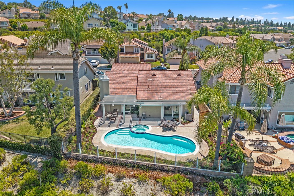 Amazing, turnkey home with a sparkling pool, spa and endless views! The large single level home has vaulted ceilings, a brand new kitchen with stainless steel appliances and is freshly painted both inside and out. Upon entering you will be in awe of the gorgeous new flooring along with all new lighting throughout. Step outside to your beautiful, lush new landscaping and enjoy your outdoor oasis. This home is located on a desirable street with both privacy and views galore! Close to Lake Mission Viejo, hiking and walking trails, schools and entertainment. This home has it all!