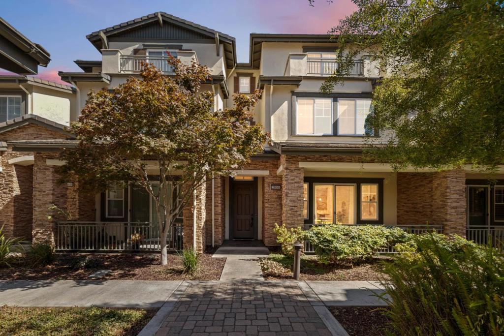 Welcome to this spacious 4-bed/ 4.5-bath, this luxurious Toll Brothers townhome tucked away in the highly desirable Willow Glen Place Community. This home offers comfort, privacy, and style, ideal for multigenerational living or hosting guests, with each bedroom featuring its own ensuite bath plus an additional powder room on the main level. Designed for both everyday living and entertaining, the open-concept kitchen has matching stainless steel appliances, double oven, sleek countertops, and ample cabinetry. A versatile third-floor space has its own bedroom and full bath provides the perfect flex space think home theater, library, or guest suite. An attached two-car garage is outfitted with epoxy flooring and extensive custom California Closets while two more owned spaces are available. Extensive upgrades throughout include: engineered hardwood floors, upgraded tile and cabinetry, recessed lighting, surround sound wiring, built-in security system, newly installed carpeting, and a custom closet in the primary suite. Enjoy resort-style amenities including a sparkling pool, well-equipped gym, clubhouse, firepit area, and a playground. Just moments from dining, shopping, and a short drive to downtown Willow Glen, Campbell, The Pruneyard, and very convenient to 280, 85 & 17.