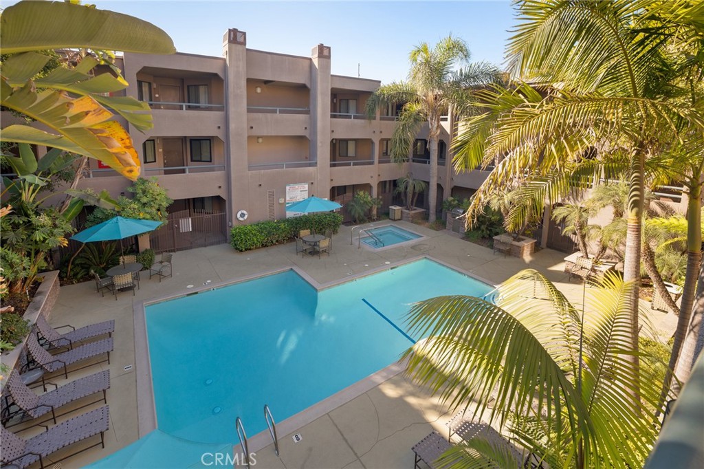 Welcome to your perfect home in Pacific Cove, one of the most desirable communities in Playa Del Rey. This move-in-ready home offers the best of coastal living with modern comforts, and is just a mile from the beach, conveniently located near restaurants, coffee shops, LAX, Silicon Beach, bike paths, and all major Westside & South Bay destinations. Don’t miss out on this amazing opportunity to experience resort-style living in Playa Del Rey!
Situated in a convenient location of the 80 unit complex, Unit 222 provides easy access to two tandem parking spaces with a personal storage unit. The thoughtfully designed floorplan includes two bedrooms and two baths, each situated on opposite sides of the spacious living room, which features a cozy fireplace. The open kitchen with an added pantry and dining area with custom wine rack create a central hub, perfect for daily living and entertaining. This flexible layout accommodates a variety of living needs.
The primary suite includes two closets, a dual vanity, and a relaxing bathtub, while the second bedroom is bright and spacious, perfect for use as a guest room or home office. The stacked laundry center, cleverly located in the guest bath, is easily accessible yet out of sight when not in use.
Step out from the living room onto your private balcony overlooking the sparkling pool and courtyard, perfect for relaxing in the sun, container gardening, or unwinding with a good book.
Pacific Cove’s amenities elevate your lifestyle with a gated guest parking lot, outdoor pool and spa, BBQ area, newly renovated fitness center, sauna, secure package room, and bike storage.
Enjoy the best of Playa Del Rey’s coastal charm, from morning strolls on the beach to vibrant local dining and shopping. With low HOA dues and a prime location, this home is ready for you to move in. Schedule a tour today!