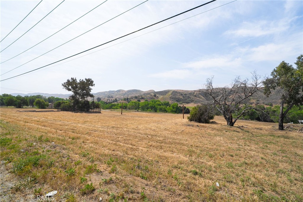 Rare and remarkable opportunity to own a highly sought-after piece of land off Live Oak Canyon Rd—where flat usable vacant lots seldomly come on the market! Set against a backdrop of beautiful rolling hills, this flat, fully usable lot offers the ideal canvas to create your custom dream home, ranch, or to develop for future investment.
Zoned for residential acreage, the property offers incredible flexibility and potential. It can be subdivided into two separate parcels, making it perfect for building multiple homes, a family compound, or selling one portion while developing the other. A charming creek runs along the back of the lot, adding natural beauty and serenity to the landscape. Modern conveniences are close by, including access to cable and an on-site private well already in place.
A prior home once stood on the land and was lost to fire, but the existing foundation still remains—offering a possible head start on future construction (buyer to verify) and access to utilities. Whether you’re a developer, investor, or someone ready to bring your vision to life, this property is rich with opportunity and promise.
Don’t miss this incredibly rare chance to own land in a location where nothing ever goes for sale. The possibilities are endless, don't miss out on the opportunity to call this your very own!