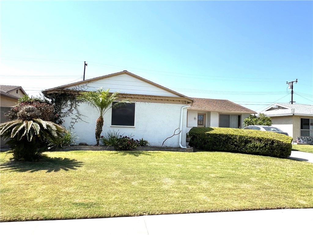 Welcome to 8940 Comet Circle, a charming 3-bedroom, 1.5-bathroom home located on a cul-de-sac in a highly desirable Westminster neighborhood. The primary bedroom includes a convenient half bathroom, while the updated full bathroom is located off the hallway. This property features a spacious living room and a cozy family room with a fireplace. Step outside and experience your own tropical retreat, complete with lush plumeria trees, a covered patio with terra-cotta style floor tiles, and a built-in brick barbecue—ideal for entertaining and outdoor dining. Situated near parks, shopping centers, and easy freeway access, this home offers the perfect balance of comfort, charm, and convenience. Don’t miss the opportunity to own a one of- a kind home in a desirable location!