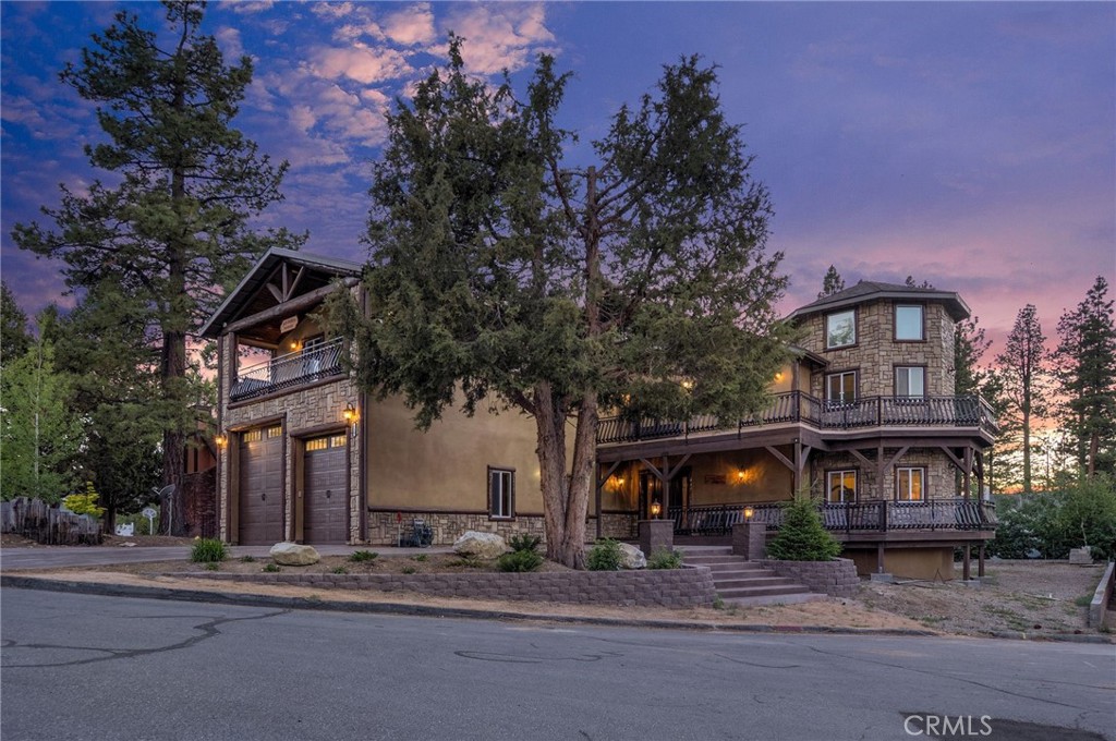 Exquisite Mountain Retreat at 216 Alp Court, Big Bear Lake, CA 92315
Tucked away in the tranquil Eagle Point neighborhood of Big Bear Lake, this 5,248-square-foot masterpiece at 216 Alp Court redefines mountain luxury. Boasting 5 spacious bedrooms and 7 elegantly appointed bathrooms, this custom-built residence is crafted for those seeking sophistication and comfort in a stunning alpine setting. Perfectly situated on a quiet cul-de-sac, it offers seamless access to the shimmering lake, Snow Summit ski slopes, and the vibrant Village, blending adventure with serenity.
Step inside to a grand open-concept living space where a gourmet kitchen, dining area, and family room unite for effortless entertaining. The chef’s kitchen dazzles with gleaming granite countertops, rich Knotty Alder self-closing cabinetry, and a sleek wet bar that elevates every gathering. Soaring ceilings and expansive windows frame breathtaking views of the lake and Snow Summit, flooding the home with natural light and a sense of boundless tranquility.
Each of the five bedrooms is a private sanctuary, with two luxurious master suites featuring spa-inspired en-suite bathrooms. Two additional guest bathrooms ensure ample space for family or friends. Upstairs, a versatile game room with its own wet bar offers a perfect spot for recreation or relaxation. Outside, two expansive rear decks, including an upper wraparound deck, invite you to savor cool mountain evenings, stargaze under clear skies, or soak in the surrounding beauty.
Modern conveniences abound, including two tankless water heaters for endless comfort and a massive four-car attached garage with RV parking, ideal for outdoor adventures. Zoned for single-family, this property offers flexibility for multi-generational living or as a high-producing rental. Set within the esteemed Bear Valley Unified School District, it combines practicality with picturesque charm. This home comes fully furnished.
All information, including square footage, bedroom/bathroom counts, features, and ownership vesting, is deemed reliable but not guaranteed. Buyers must verify details via due diligence. The seller is the owner and a licensed real estate agent.
Schedule your private tour today and embrace mountain living at its finest!