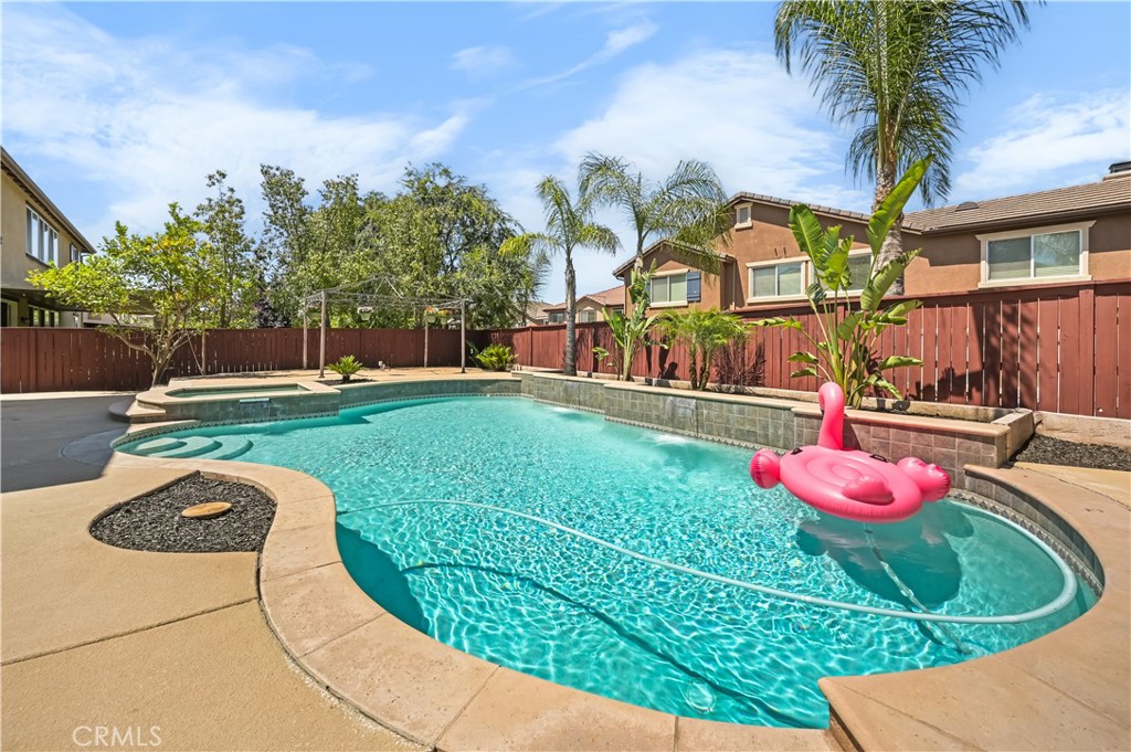 Very rare 6 spacious bedrooms, 4 full baths, 3,923 sq ft pool home in the desirable North Star Ranch community in Murrieta. This exquisite two-story home provides comfort, elegance, and tranquility. Freshly painted exterior and interior, new carpet throughout. From the covered front porch, you step inside through the impressive entrance. You are welcomed by soaring 20-foot vaulted ceilings and beautiful new luxury waterproof vinyl flooring seamlessly transitioning into an expansive dining area and an open kitchen. The spacious kitchen, featuring a large island, boasts granite countertops, dual ovens, solid cabinets, a convenient pantry, and a large menu desk that opens to the expansive family room with a cozy fireplace, which offers surround sound and a media niche for all your entertainment needs. This open floor plan enables seamless interaction between the kitchen and living spaces, making it ideal for entertaining guests. Not to mention a desirable bedroom on the first floor with a full bathroom. The second floor features a large loft with a built-in computer desk and workstation overlooking the formal living room. And master bedroom with two walking closets connected to a full bathroom with dual sinks, a soaking tub, and a separate shower, vanity area, and tile floors.
The four additional large bedrooms have a Jack and Jill bathroom setup for two of the bedrooms and another full bath for the two remaining bedrooms. Upstairs laundry room. This community features two wonderful parks within a short walking distance, shopping nearby, and easy access to transportation. This hard-to-find floor plan offers a haven for you to enjoy peace in a wonderful neighborhood, with plenty of living space, a fabulous, refreshing pool, and spa for fun and recreation, making it an entertainer's paradise. Let's not forget the 4-car tandem garages and prestigious school district from kindergarten through 12th grade. Just minutes away from the 215 / 15 roadway and 79.
