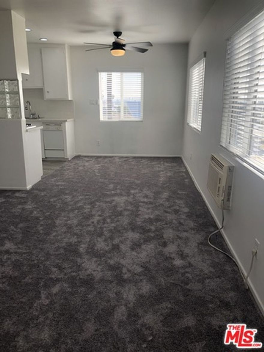 MOVE IN NOW...READY FOR OCCUPANCY NOW!!!  Large spacious light filled unit. Features: Fresh Paint, Newer Carpet, Updated Kitchen with granite counters, stainless steel sink, newer faucet, tile floors, recessed lighting, built in appliances, refrigerator. Updated bathroom with newer vanity, granite counters and sink, newer mirror, wood faux tile flooring, recessed lighting, and shower enclosure.  Recessed lighting in living room, kitchen and bathroom.  Smooth ceilings. Ceiling fans in bedroom and dining room.  Dual pained windows. Newer custom window treatments. Master bedroom has large closet with sliding mirror doors, ceiling fan, air conditioner. Linen and closet in hallway.  Ample storage.  One off street parking space provided. Close to public transportation, shops, houses of worship, and close to the ocean! Non smoking unit.  Sorry no pets. Call for Rentspree application process.  RENTSPREE.COM LINK:   https://apply.link/FrOA8nY  $49.99 FEE PER APPLICANT.