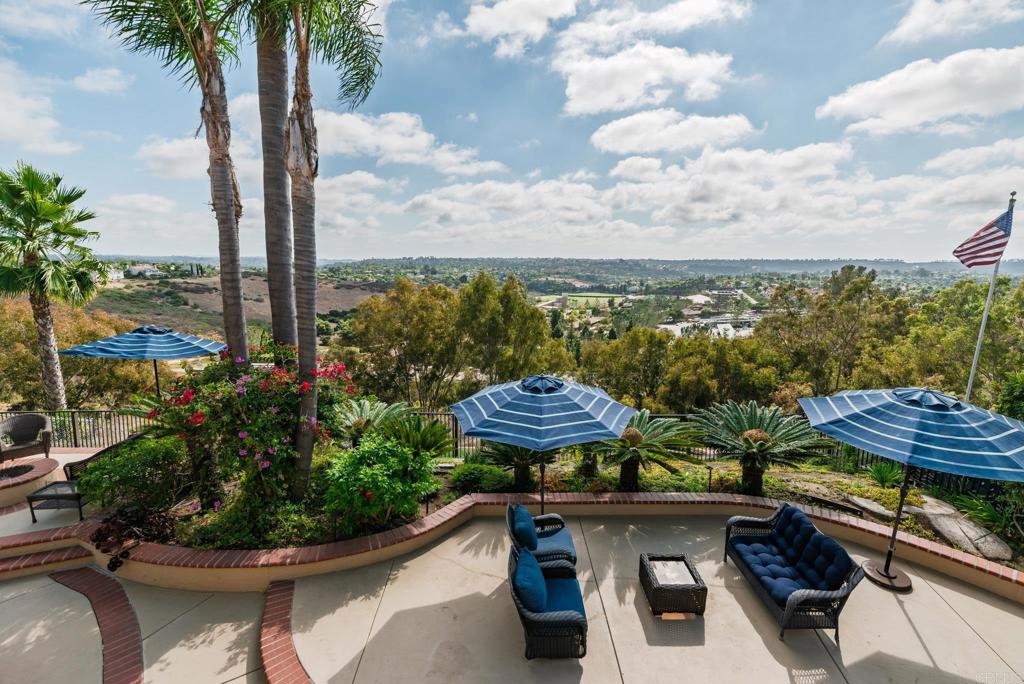 Every day feels like a getaway in this beautiful home in the heart of La Costa Knolls, with some of the most stunning views in Carlsbad. Perched on a hillside on a quiet cul-de-sac street, this home was designed to take full advantage of its setting—you’ll enjoy sweeping panoramic views from nearly every angle, with rolling hills and unforgettable sunsets as your daily backdrop. Whether you’re sipping morning coffee, hosting friends, or winding down in the evening, the views here make every moment feel special. Inside, you’ll find a bright, open floor plan with French oak floors, plantation shutters, and two cozy fireplaces that set a warm, inviting tone. An extra-wide staircase makes a striking statement, while a convenient main-floor bedroom with direct access to the backyard offers flexibility as a guest room or the perfect home office. The kitchen was fully remodeled just 5 years ago and is a chef’s dream, featuring a 6-burner gas range, gorgeous stainless steel appliances, and stunning countertops. The bathrooms have all been beautifully updated as well, and the primary suite feels like a personal retreat, featuring a freestanding soaking tub for a spa-like touch, plus private access to the Trex deck (under 5 years old), where you can step out and take in the views from sunrise to sunset. The backyard is perfect for entertaining, with plenty of space for gatherings, barbecues, or simply soaking in the gorgeous Carlsbad weather and scenery. A 3-car garage with upgraded flooring and generous storage pairs beautifully with the newer roof (under 5 years old), showcasing the thoughtful care this home has received. Even better—there’s no HOA and no Mello Roos. Living in La Costa Knolls means being close to top-rated schools, golf courses, hiking trails, shopping at La Costa Town Square and The Forum, and just a short drive from Carlsbad’s beautiful beaches. It’s the perfect balance of convenience, community, and everyday luxury.