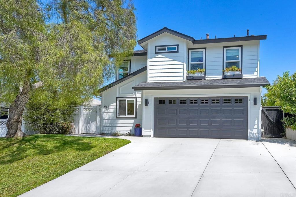 Charming Updated Home with Views in Olde Carlsbad Storybook charm meets modern upgrades in this beautiful home located in the heart of Olde Carlsbad. Exceptional curb appeal, lush landscaping, and panoramic views set the stage for this inviting property. Gated front entry opens to a private oasis with mature fruit trees, vibrant gardens, and multiple outdoor entertaining areas. Inside, enjoy an open floor plan with vaulted ceilings, abundant natural light, and a cozy fireplace. The remodeled light-filled kitchen features new cabinetry, sleek quartz countertops, a farmhouse sink, and newer appliances. French doors lead to a peaceful backyard retreat with sweeping views. Upstairs includes an expanded loft—perfect for a home office or creative space—plus a spacious primary suite with dual closets, two additional bedrooms, and a full bath. Located in a friendly neighborhood with large greenbelt areas and complimentary RV parking. Convenient access to Carlsbad Village, beaches, and top-rated schools: Magnolia Elementary, Valley Middle, Carlsbad High, and Sage Creek High. Recent updates include new exterior siding and paint (3 months), a new furnace and air conditioning system (4 years), a new roof (8 years), a fully remodeled kitchen with appliances (3 years), a new driveway (6 months), an expanded loft space (4 years), and a new gate and fencing (4 years). Fruit trees on the property include two peach, two apricot, two pear, two cherry, nectarine, pomegranate, Bearss lime, mandarin, and Meyer lemon. Do not miss this unique opportunity—move-in ready with character, comfort, and stunning views!