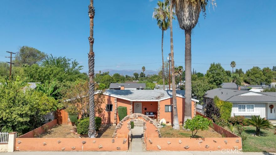 Welcome to a fantastic opportunity in the heart of Winnetka! This 3-bedroom, 2-bathroom home offers 1,420 sq. ft. of living space on a spacious 7,225 sq. ft. lot, perfect for buyers who want to create their dream home or investors seeking their next project. The home features a classic single-story layout with a bright living room, charming built-ins, and direct access to a covered patio and large backyard. The galley-style kitchen has generous cabinet space and opens to the dining area, providing a solid foundation for a modern redesign. The bathrooms showcase original details, giving buyers the chance to reimagine them with today’s finishes. Outside, you’ll find a large, private yard with mature palm trees and plenty of space to landscape, garden, or even add a pool. The detached garage and long driveway offer ample parking, and the garage which is connected to sewer and water is an excellent candidate for a conversion into an ADU, for extended family or rental for additional income. This property is ideal for contractors, flippers, or homeowners looking for a value-add opportunity. With some creativity and vision, this home can be transformed into a beautiful residence or an income-producing investment.