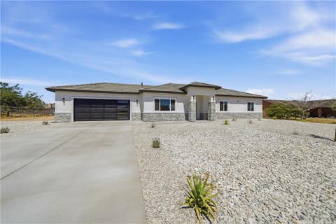 Photo of 12658 Standing Bear Road, Apple Valley, CA 92308 (MLS # CV26135155)