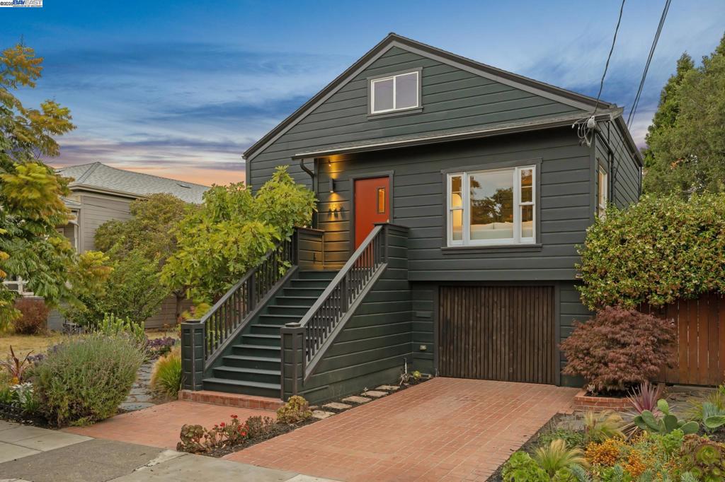 Located just 2 blocks to both Webster St cafes/shopping and the SF Trail along the Bay, this lovely vintage home embodies the elegance of a bygone era brought into the modern world, in which charming details of the past blend seamlessly with the modern conveniences of contemporary living. Built in 1910 and thoughtfully remodeled and expanded by the present owners, the home features 4 bedrooms, 2 bathrooms, a spacious living room (with fireplace), an open kitchen/dining room, family room and an attached garage. Details include hardwood floors + vintage doors, hardware & window trim. Kitchen + bathrooms were remodeled 2021-2023 + a complete lower level remodel in 2022. This home has been thoughtfully designed to take full advantage of the East Bay's wonderful climate w/fabulous outdoor spaces including decks, patios, pergolas—even a custom greenhouse built with repurposed vintage doors + windows! The oversized lot is the backdrop for fruiting fig, apple, pear, lemon, avocado, plum & nectarine trees, as well as carefully curated colorful native landscaping. Raised garden beds for seasonal plantings can be watered with well water on the property! A detached, upgraded home office at the rear of the property has ADU conversion potential. Delightful, both inside and out! Very special.