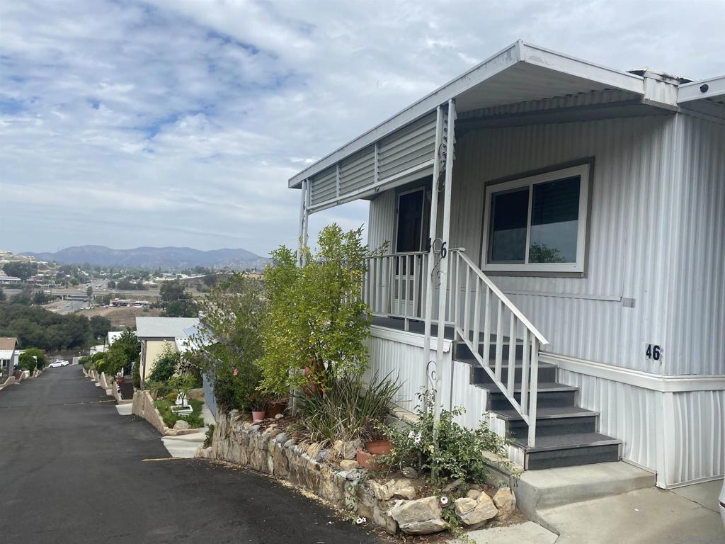Nestled at the top of the hill this Mobile Home enjoys privacy and views! Just open the windows to to enjoy the cool breeze that flows through the home or just click on the A/C! This is an "All age Park!" New dual pane windows through out! Newer Central A/C. Full sized Washer/Dryer located off the kitchen. Primary bedroom with walk-in closet. Laminated flooring in Living and dining room. This park is conveniently located right off the 8 freeway! It has a community pool, and clubhouse attached to the management office. Residents are charged per month for the land lease. In addition residents are also charged for their individual usage of utilities per month which include; gas, electricity, water, sewer, trash and recycle.