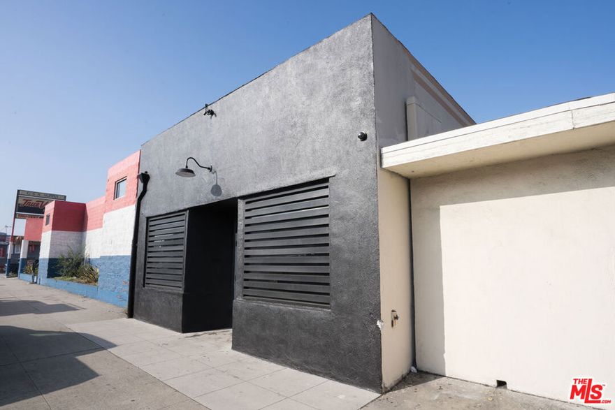 Fully renovated, industrial modern retail flex space with a gallery aesthetic in South West Long Beach. This 2,200 Sq Ft storefront sits on a 2,800 Sq Ft lot along a major thoroughfare for high visibility. Located in Long Beach's CHW zone, which allows for a variety of uses.The design blends polished concrete floors with beautifully restored exposed wood ceilings, creating a contemporary, gallery-inspired environment that balances clean lines with warm architectural texture. The rear kitchenette bar area opens up to a private, secure rear parking lot that can be used as private outdoor patio space.The layout is flexible and optimized for a showroom, art gallery, studio, industrial office space, micro brewery, pop-up, or creative retail concepts. Featuring curated lighting and a modern storefront presentation that invites brands to showcase products and art in a sophisticated, urban setting.