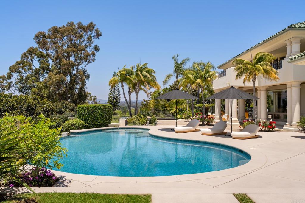 Perched at the end of a quiet cul-de-sac on a prime, 1 acre parcel, this extraordinary estate captures sweeping west-facing ocean views and exemplifies luxury living in the prestigious guard-gated golf community of The Farms at Rancho Santa Fe. Recently completed in 2025, the residence has undergone a high-end, comprehensive renovation with every detail and design finish personally curated by award-winning designer Maria Barry of LeDimora. From the moment you enter, you’re greeted by grand-scale living spaces, bespoke finishes, and a seamless indoor-outdoor flow that celebrates the home’s remarkable setting. As a unique bonus, for residents who are also Rancho Valencia members, enjoy private gated access to the adjacent Rancho Valencia Resort, offering convenient entry to its world-renowned spa, acclaimed Pony Room restaurant, and top-tier tennis facilities. This is a rare opportunity to own a fully renovated showpiece in an elite enclave, just moments from world-class golf, dining, and coastal access.