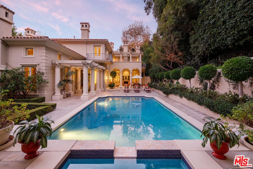 Perfectly situated on over an acre of beautifully manicured land in the highly coveted area of Lower East Bel Air Gate is "The Lee Iacocca Estate," a masterfully designed & impeccably inviting Tuscan style home. The residence affords its guests four spacious en-suite bedrooms, staff apartment with bed/bath suite and dining room, two additional bathrooms, five fireplaces, a tennis court and pool & spa. The Italianate-style home's high ceilings, meticulous craftsmanship and sweeping rooms on the main floor make entertaining guests easy. The residence's long driveway and abundant space for parking contributed to the rich history of lavish parties. It is no wonder why prominent figures spent countless nights at the late automotive executive's residence. They include Bob and Dolores Hope, Frank and Barbara Sinatra, Barbara Davis Priscilla Presley, Betty White, among many others. The home is conveniently just moments from the Bel-Air Country Club and across from Bel Air Hotel's S entrance.