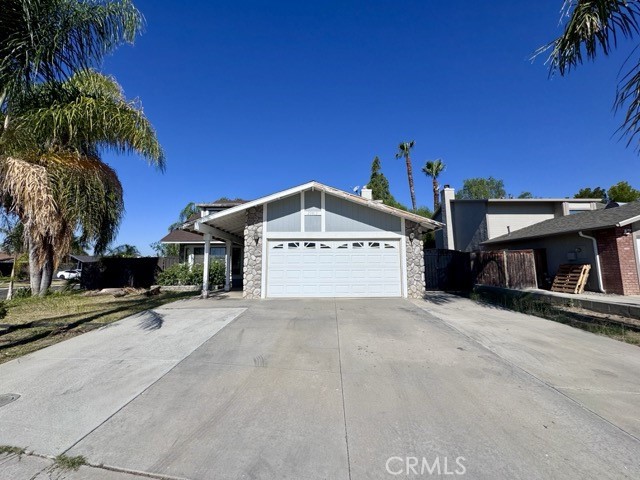 Welcome to this 3 bedroom, 2.5 bathroom two story Menifee home for lease with a versatile bonus room! Situated on a large corner lot, the property features a two car garage and charming curb appeal. Inside, you’ll find a neutral paint scheme, tile flooring, and a functional layout. The entry opens into the living room, which flows seamlessly into the dining area. Just adjacent is the upgraded kitchen, showcasing gray shaker-style cabinets, quartz countertops, stainless steel appliances, and a peninsula for extra prep space. The kitchen opens to the cozy family room, complete with a fireplace. Also downstairs are the laundry room and a convenient half bathroom. Upstairs, you’ll discover all three bedrooms, the additional bathrooms, and the bonus room with vaulted ceilings. This versatile space can serve as a playroom, office, storage area, or even a 4th bedroom. The primary suite is generously sized and includes an ensuite bathroom with a shower-tub combo, single vanity, and a dedicated makeup/getting-ready vanity. Venture into the backyard and enjoy your own private oasis featuring a large covered patio, lush landscaping, a sparkling pool and jacuzzi, and a gazebo/patio area perfect for relaxing or entertaining. This home is ideally located near freeway access to the 215 and 15, as well as parks, schools, shopping, dining, and more. Schedule a showing today and experience all this home has to offer!