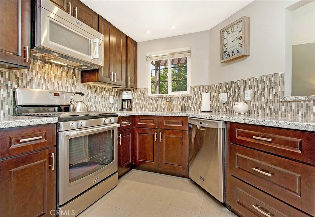 Look no further! The owners have spared no expense in this beautiful 1 bed/1 bath end carriage unit. Located in the highly desirable Crestline community in Laguna Hills. This stunning single-level condo is accessed by stairs leading from the one-car garage located directly below. Private front patio. Upon entering the front door, you are welcomed into a sunlit living and dining area with a pleasing soft color palette and ceramic porcelain tile flooring throughout. Windows are dual-paned with UV protection and slat blinds. The kitchen has custom cabinetry,soft-close doors and drawers, stainless steel appliances, ceramic tile backsplash, granite countertops, and recessed LED lighting. Full-size HE stackable washer/dryer. Main bedroom is spacious. Double mirrored sliding doors on the closet. Custom vanity with soft-close doors and drawers, a single sink, granite countertop, large decorative framed mirror. The shower and toilet area are separately enclosed. The walk-in shower is porcelain and beautiful glass mosaic tile and a seamless glass door. Newer AC, furnace, water heater, ductwork, and PEX-piping throughout. The community offers access to 3 pools, spa, and a community center. Located close to the 5 Freeway and the 73 Toll Road. Conveniently located to parks, bike and hiking trails, restaurants, shopping, and of course just a short drive to any of our incredible Orange County beaches!
