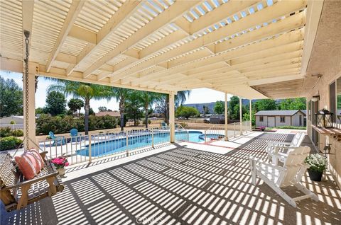 Photo of 31970 Saint Pierre Ln, Lake Elsinore, CA 92530 (MLS # SW26054899)