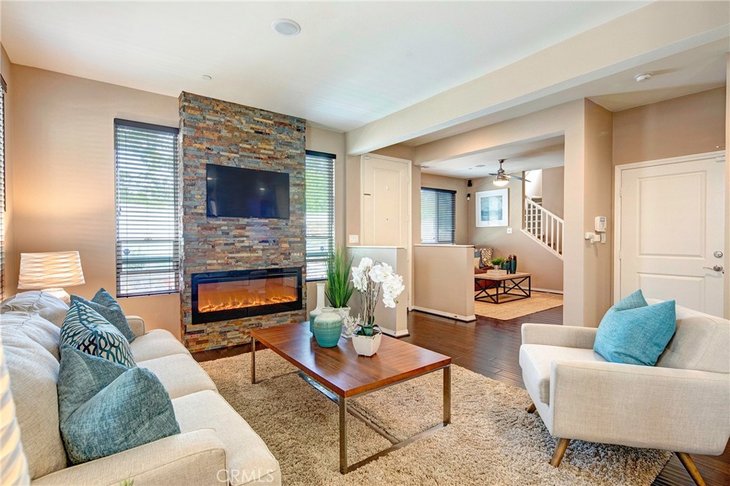 SoFi Stadium, Intuit Dome, COSM, The Kia Forum, Tesla, Space X, the Future! Built in 2014, stunningly upgraded, 4 bedroom, 2.5 bath, 2,126 sq ft. home with surround sound throughout, air conditioning (A/C), engineered wood flooring, and large backyard. PROPERTY TO BE DELIVERED UNFURNISHED. The main level consists of a private 2 car, direct-access garage, large open floor plan w/breakfast counter, chef’s kitchen w/all stainless appliances, granite counter tops, dining area, living room with beautiful stone wall and fireplace, downstairs powder room, and additional family room also with a beautiful stone wall that makes a perfect movie, entertainment, or play room. Opens to a large private backyard with fountain and low-maintenance artificial turf. Upstairs you will find an oversized master bedroom w/ two walk-in closets, en-suite master bath with soaking tub, and walk-in shower. Three additional large bedrooms (one that is currently set up as a home office), an additional full bathroom, and separate laundry room with custom enhancements complete this wonderful home. Additionally, this home has no common walls! The Parkside Village amenities include gated and secured entrance, swimming pool, jacuzzi, tot lot, tranquil walk ways, and tons of guest parking.