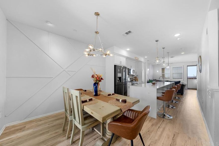 FHA & VA APPROVED. MAIN LEVEL BEDROOM AND FULL BATHROOM. MOUNTAIN VIEWS. DUAL PRIMARY SUITES. TWO BALCONIES.   Welcome to 5211 Calle Rockfish #90. A stunning 3-bedroom, 3.5-bath home in the highly sought-after gated community of Playa Del Sol. Built in 2018, this contemporary residence offers 1,626 sq. ft. of open and functional living space designed for comfort and style.  The main level features an attached 2-car garage and a full bedroom and bath, perfect for guests, multi-generational living, or a home office. The heart of the home is the open-concept kitchen, complete with quartz countertops, stainless steel appliances, white cabinetry, and a massive 12-foot island that flows seamlessly into the dining and living areas. Upstairs, the private owner’s suite offers a spa-inspired bath with dual vanities, a glass-enclosed shower, and a generous walk-in closet.  Additional highlights include luxury vinyl plank flooring, recessed lighting, in-unit laundry, and an attached two-car garage.  Residents of Playa Del Sol enjoy resort-style amenities, including a fitness center, swim club and spa, clubhouse, rooftop lounge, BBQ areas, and beautifully landscaped common areas. Conveniently located near top-rated schools, Cesar Solis Community Park, shopping, dining, and just a short drive to downtown San Diego. This home perfectly blends modern living with everyday convenience.