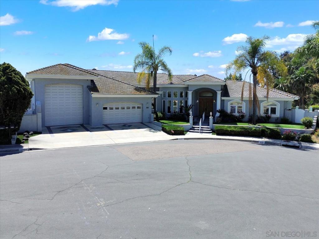 Single-Level Oasis with Unmatched Views, Privacy, and a Rare 46’ RV Garage. Welcome to 6727 Cavite Ct, a show-stopping single-level retreat perched on a private half-acre cul-de-sac lot in Del Cerro’s coveted Princess Del Cerro neighborhood. This one-of-a-kind home blends timeless design with modern upgrades and panoramic west-facing views—perfect for entertaining, relaxing, and storing all your toys.? Massive 46' x 15' RV/boat garage with 220V outlets and 14’ clearance—ideal for your rig, trailer, boat, or car collector’s dream. Unobstructed sunsets from your wraparound patio, with multiple seating areas and elegant hardscape. Open-concept great room with custom built-ins, gas fireplace, skylights, and direct patio access. High ceilings throughout. Elegant kitchen with Italian Carrara marble flooring, breakfast nook, and updated stainless steel appliances. Spacious primary suite with dual vanities, huge cedar-lined walk-in closet, and patio access. Flexible fourth bedroom or home office. Lush, low-maintenance landscaping with artificial turf and mature palms. Two-car garage + RV garage -- ample room for guests and gear. Notable Upgrades: Crown molding and recessed lighting throughout. Intercom and camera systems for added security. Energy-efficient dual-pane windows and patio doors. Indoor laundry room with storage and utility sink. Superior Location, Lifestyle & Convenience: Tucked away on a quiet cul-de-sac with no through traffic. Minutes to Mission Trails, top-rated schools, shopping, and freeways. Highly rated Marvin Elementary, Lewis Middle, and Patrick Henry High.