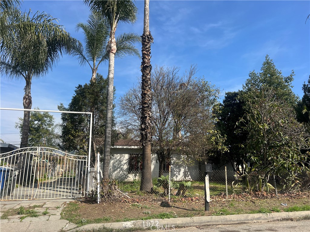 Bring your tools and vision! This is a 2 bedroom, 1 bathroom single family residence. Property needs some work. Excellent opportunity to create your dream home. The layout includes kitchen, living area, two bedrooms and one full bathroom. The expansive lot has fruit and palm tree and offers room for outdoor living, a garden or the potential to add an ADU, subject to local zoning and permitting requirements. Convenient access to the 210 freeway. This property is full of potential.