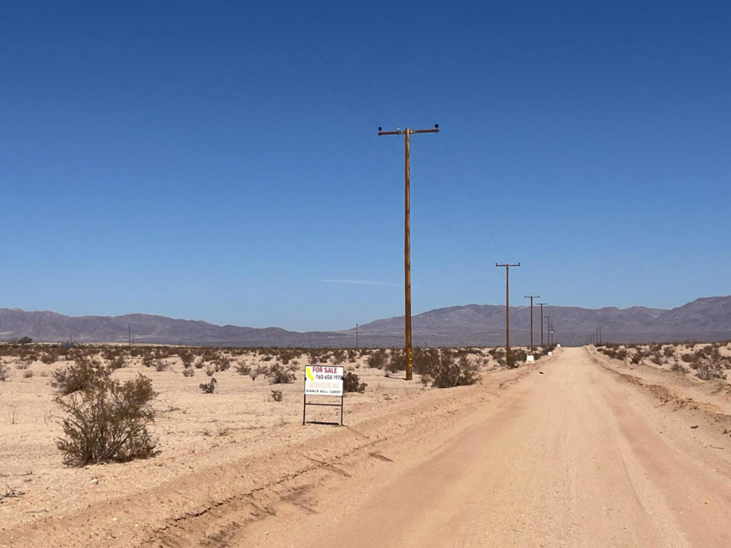 DANBY ROAD, 29 PALMS $15,000.00 - This 2.1-acre parcel is part of a fantastic opportunity for developers with 4 lots a total of 7.74 acres available in the desirable Wonder Valley area of Twentynine Palms. Dimensions 331 X 290 = 95832 sq. ft. The property is ideally located near amenities such as the Wonder Valley Community Center Park with restroom and off roading areas. This level land is ready for construction. Electricity runs along the street. The option to purchase lots separately or together, this is a great investment opportunity. Owner Will Carry Loan with 20% down $3,000.00 a 1st Trust Deed of $12,000.00 @ 7% interest amortized over 5 years payable $237.61 monthly + $15.00 monthly loan service fee DIRECTIONS: From Downtown 29 Palms go east on Amboy Road about 8 miles to where Community Center Park is go just past it to right on Danby Road. 5 contiguous lots on right side for sale look for FOR SALE signs. APN0625-372-04-0000.