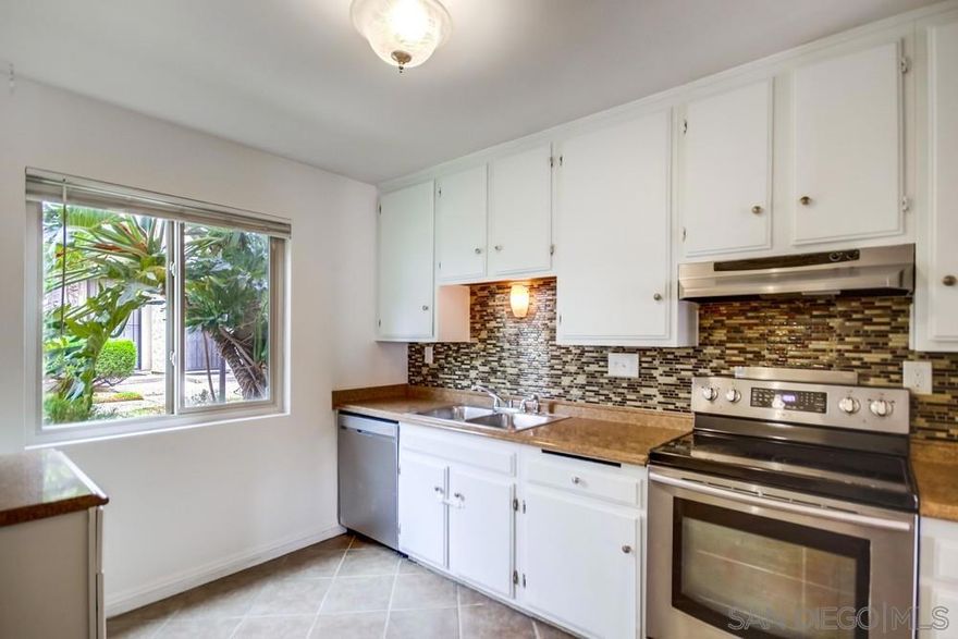 Price IMPROVEMENT this week for the very BEST Value in SD County with absolute quality!!! Welcome to Bella Vista Estates! This charming end-unit 2BR/1.5BA townhome offers extra privacy with no neighbors behind and only one shared wall. Enjoy your own fenced back patio yard with large storage (fits full-size W/D)  perfect for gardening, BBQ, play yard, or relaxing outdoors.  Inside, you’ll find a light-filled open floor plan with neutral tones, durable tile/laminate downstairs, and cozy carpet upstairs. The spacious kitchen flows seamlessly into the living area and out to the patio.  Community perks include a sparkling pool, clubhouse, and low HOA dues covering water and trash. Parking is a breeze with your deeded space directly behind the backyard patio, plus a companion assigned spot right next to it,  giving you two designated spaces of your own. Each home also comes with two guest passes, and there’s plenty of additional street parking both at the front cul-de-sac and back entrance. All this just steps to Berry Street Park, plus quick freeway, shopping & dining access. A fantastic first home or smart investment..don’t miss this opportunity!