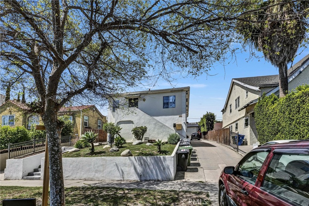 Welcome to 1861 S Redondo Blvd. This upgraded 4-unit income property features a triplex plus a newly built 2 bed, 2 bath ADU (approx. 700 sqft) with solar. One of the original 2 bed, 2 bath units has been fully renovated and is currently vacant, offering the perfect opportunity for an owner-occupant to live on-site while renting out the other units to help offset the mortgage. The combined living area is approximately 3,244 sqft on a 5,834 sqft LARD1.5-zoned lot. Recent improvements include upgraded electrical panels and a new sewer liner. All other units are tenant-occupied, generating steady rental income.