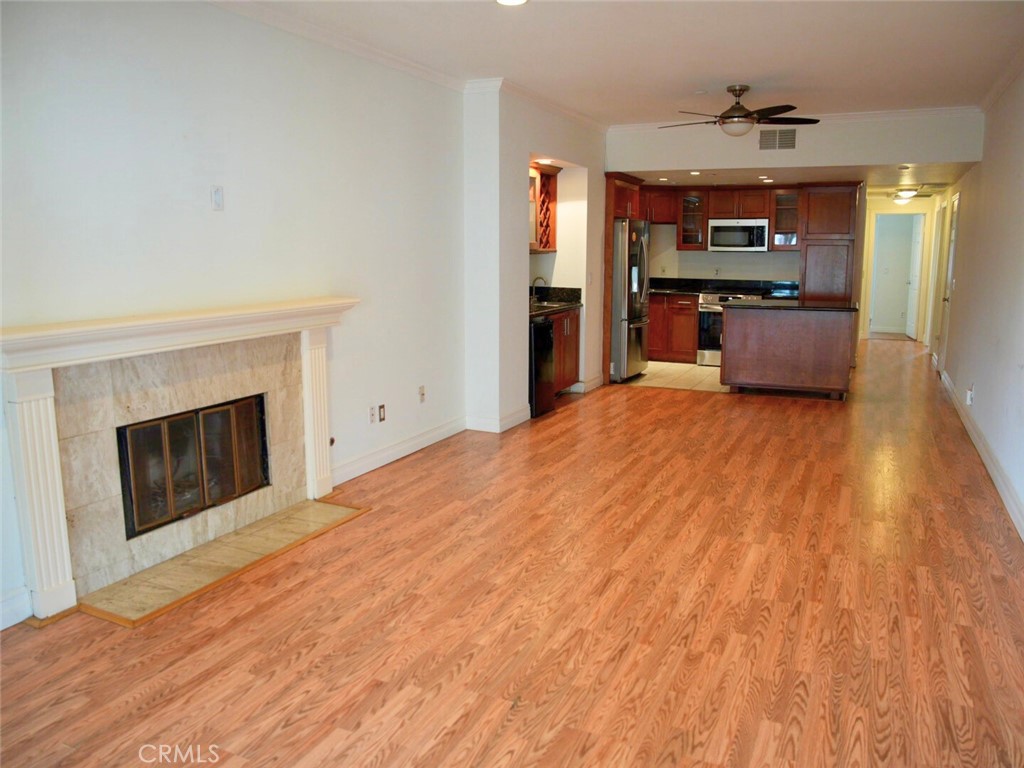 Welcome to resort-style living in this beautifully maintained 2-bedroom, 2-bath condo located in the desirable Los Caballeros community.
Situated on the third floor with both stair and elevator access, this unit offers tranquil views of the community pool and lake.
Step inside to find a spacious living room with an open floor plan, complete with a cozy fireplace, wet bar, built-in wine rack, and mini fridge—perfect for entertaining. The kitchen features a central island with storage, granite countertops, stainless steel appliances, a gas stove, microwave, and dishwasher.
The primary bedroom includes mirrored closet doors, a custom closet organizer, and an ensuite bathroom. The second bedroom is generously sized and located adjacent to a full hallway bathroom. A separate laundry room comes equipped with a full-size washer and dryer, which are included in the sale, along with ample cabinet space.
Enjoy the community's resort-like amenities, including a sparkling pool, relaxing jacuzzi, BBQ area, and serene lake. This unit comes with one assigned covered parking space, with one parking lot spot.
Centrally located near major freeways, shopping centers, and Mile Square Park—this home offers the perfect blend of comfort, convenience, and lifestyle.