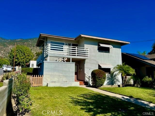 This is an exceptional two bedroom, one bath upstairs unit, one of only two units ideally located in the quaint town of Sierra Madre. Outdoor features include 2 private patios perfect for Al-Fresco dining or relaxing with sweeping picturesque mountain views and a lush manicured front yard. The large picture windows in the main living area fills the unit with natural light. Both bedrooms offer spacious walk-in closets, window A/C units and ceiling fans. The second bedroom offers a flexible option for a home office or private gym! Additional built-in storage can be found in the hall off of both bedrooms. The kitchen features track lighting, dishwasher, range/oven, garbage disposal and spacious walk-in pantry. The bathroom features a tub/shower combination, immaculate original tile, and a large vanity medicine cabinet. The unit comes with a washer and dryer, USB charging outlets and is cable ready. Parking consists of a one car garage with one additional parking space. The property offers quick access to the metro/freeway, hiking trails, parks and is conveniently located to shopping and dining in downtown Sierra Madre. THE IDEAL PLACE TO BALANCE LIFE, WORK & PLAY.