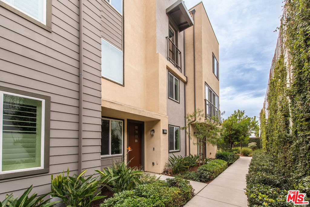 Welcome to this Stylish, Modern Townhome in the Heart of El Segundo's "Waypointe" Community. Built in 2019, this rarely-available 3-bedroom, 3.5-bath centre-hall townhouse spans approximately 1,670sqft across three thoughtfully crafted levels. Soaring vaulted ceilings greet you as you enter, leading to a bright, open-concept living and dining area ideal for entertaining or day-to-day living. Chef-ready kitchen with quartz countertops, stainless steel appliances, sleek cabinetry and a breakfast bar. Luxurious primary suite featuring a walk-in closet and spa-inspired en-suite bathroom with dual sinks .Private roof-top deck on the third level offers stunning city and airport views perfect for morning coffee or evening sunsets. The attached two-car garage and in-unit laundry add practical convenience. Community & Location Exclusive enclave of just 34 homes in the Waypointe complex-low-maintenance, secure, and contemporary. Situated within the award-winning El Segundo Unified School District. Conveniently located minutes from Main Street dining, shops, freeways, LAX, and coastal-hotspots providing a true South Bay lifestyle.