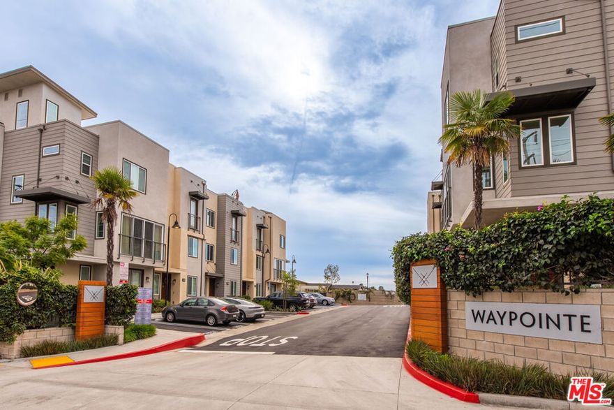 Welcome to this Stylish, Modern Townhome in the Heart of El Segundo's "Waypointe" Community. Built in 2019, this rarely-available 3-bedroom, 3.5-bath centre-hall townhouse spans approximately 1,670sqft across three thoughtfully crafted levels. Soaring vaulted ceilings greet you as you enter, leading to a bright, open-concept living and dining area ideal for entertaining or day-to-day living.  Chef-ready kitchen with quartz countertops, stainless steel appliances, sleek cabinetry and a breakfast bar.  Luxurious primary suite featuring a walk-in closet and spa-inspired en-suite bathroom with dual sinks  .Private roof-top deck on the third level offers stunning city and airport views perfect for morning coffee or evening sunsets. The attached two-car garage and in-unit laundry add practical convenience.  Community & Location Exclusive enclave of just 34 homes in the Waypointe complex-low-maintenance, secure, and contemporary.  Situated within the award-winning El Segundo Unified School District.  Conveniently located minutes from Main Street dining, shops, freeways, LAX, and coastal-hotspots providing a true South Bay lifestyle.