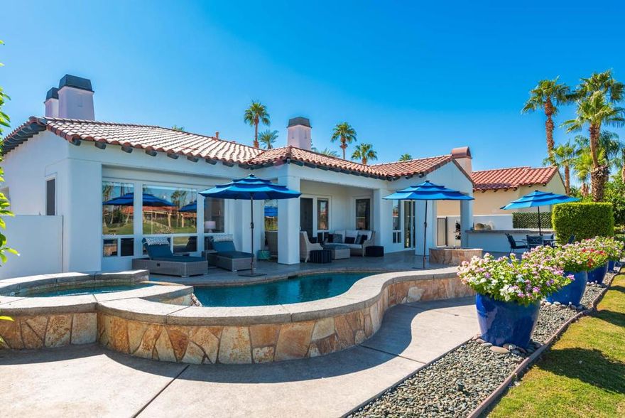 Welcome to The Citrus Club in La Quinta, where timeless design, comfort, and location come together beautifully. This elegant home sits along the 14th hole and offers a perfect balance of sophistication and easy desert living. Inside, natural light fills the open floor plan. The inviting dining and living spaces flow seamlessly into a spacious kitchen centered around a large island that is perfect for entertaining or relaxed everyday living. A separate sitting room has been transformed into a stylish lounge and bar area with custom cabinetry and a marble fireplace. It is an ideal spot to read, unwind, or enjoy an evening cocktail. There is also a bonus room that will make a great office or exercise room. The primary suite is a serene retreat featuring its own fireplace, a spa-style bath with a deep soaking tub, and elegant finishes throughout. Two additional bedrooms provide flexibility for guests or a home office. Outdoors, a sparkling pool and spa overlook the fairway, framed by a built-in barbecue, fire pit, and generous patio for dining under the stars. Life at The Citrus Club means access to one of La Quinta's most sought-after private golf and social communities. Ideally located just minutes from the fine dining and boutiques of El Paseo, the charm of Old Town La Quinta, and the world-famous Indian Wells Tennis Garden, home of the BNP Paribas Open, this home offers the best of desert luxury living.
