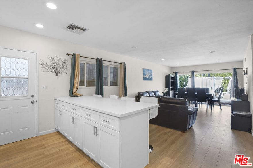 Welcome to this beautifully updated 4-bedroom, 2-bath home that perfectly combines modern style with family-friendly living. Situated on a quiet street with walking access through the park, this property offers the best of comfort, convenience, and community.Step inside and you'll be greeted by a bright, open layout filled with natural light. The kitchen is the true heart of the home, featuring a large center island, stainless steel appliances, and newer systems, along with a convenient in-unit washer and dryer. A stylish dry bar adds the perfect touch for entertaining, while the generously sized bedrooms provide ample space for the whole family one even includes a cozy fireplace for added character. The primary suite serves as a relaxing retreat with plenty of storage and closet space.The backyard is designed for privacy and low maintenance, with tall fencing, expansive space for gatherings, and a charming gazebo ideal for family barbecues or simply enjoying the outdoors together.Additional highlights include fully paid-off solar panels for energy efficiency and permitted ADU plans for the garage, giving you excellent potential for expansion or rental income. All of this in a highly walkable, family-oriented neighborhood just steps from the park and within walking distance to local shops. grocery stores and the post office. This home truly checks every box for comfort, convenience, and long-term value.