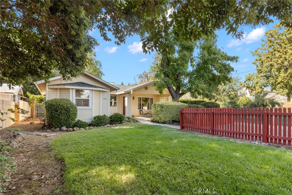 Welcome to this inviting North Chico home filled with natural light and modern comfort! Bright and open, it features large dual pane windows, soft neutral walls, and a flowing living and dining area perfect for meals or entertaining. The kitchen is designed with everyday living in mind, offering warm wood cabinetry, generous counter space, and a gas range that makes meal prep a breeze. A charming garden window adds the perfect spot for your herbs or plants. Each bedroom provides comfortable space, with one featuring private access to the backyard. The bathroom is thoughtfully designed for your daily routine, while the indoor laundry keeps chores simple and organized. Step outside and you’ll find even more to love—sip morning coffee on the front porch, let pets play in the fully fenced yard, or host cozy gatherings in the private backyard. A newer roof and HVAC system provide added peace of mind for years to come. Ideally located in North Chico near shopping, dining, and schools, this home combines comfort, convenience, and charm. Don’t miss your chance to make it yours!