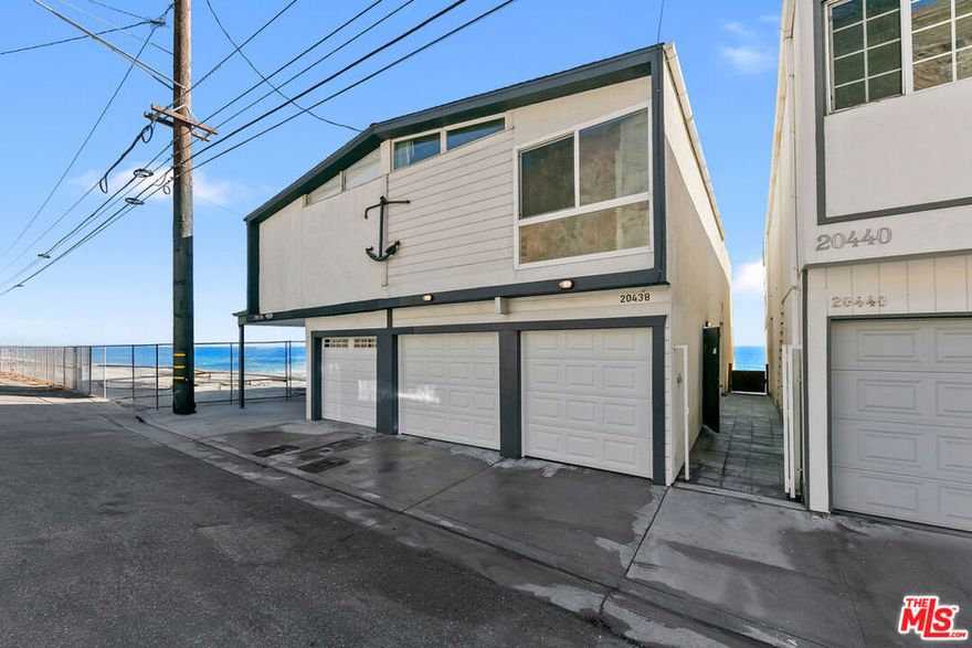 This residence sits directly on Big Rock Beach, perfectly positioned just minutes from Santa Monica and central Malibu. A rare offering on leased land at $2,100 per month (plus approx. 3% annual increase) with 38 years remaining on the lease. This beach home captures unobstructed, panoramic views of the Pacific Ocean, Catalina Island, and the Queen's Necklace from sunrise to sunset. The home features two bedrooms, plus an open den or 3rd bedroom area, and 2.5 bathrooms. The open-concept kitchen and dining area flow into a sunlit living room with a balcony perched over the sea, offering a front-row seat to the rhythm of the waves. Upstairs, the romantic primary suite includes an oceanfront balcony and spa-style en-suite bath, while the open loft/family area leads to a private guest suite with its own bathroom, and the laundry is in a closet upstairs. Multiple outdoor deck spaces create an effortless connection to the coast, from an ocean-facing deck ideal for lounging to a private subterranean patio made for al fresco dining beside the surf. A few doors away there is access to a picturesque pocket beach and cove, an idyllic escape for sunbathing, swimming, or quiet walks by the water at low tide. There is an attached 2 car garage. Own the whole building, the adjacent home is for sale as well!