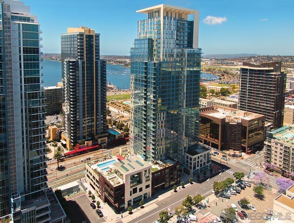 Spectacular unobstructed Bay views to Point Loma. Premium 4th Floor end unit at SAVINA. No one above. West facing condo adjacent to Little Italy. This newer 2 Bed 2 bath Condo, 2 gated parking spots included (1,402 Sq. Ft. ) high end finishes, protected view of the SD Bayfront and 'The Star of India'. HIGH CEILINGS, HVAC, private recessed balcony, 'Island' kitchen, quartz counter tops w/waterfall edges and Thermador appliances. Hardwood flooring throughout the living area & bedrooms, in-unit WASHER & DRYER, Air Conditioning, (Please preview this rental prior to submitting an application...) SAVINA 'Resort Style' amenities include: 24 hour Concierge/Doorperson, new fitness center, two-story pool/spa deck & BBQ areas, expansive social lounge, steam room/sauna.