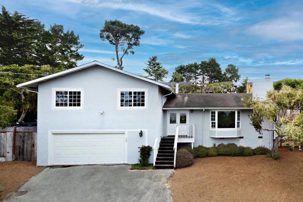 Opportunity awaits at this 4-bedroom, 2.5-bathroom home nestled in the desirable Country Club West area of Pebble Beach. Situated on an upward sloping generous 14,000 sq.ft. lot, this 1,930 sq.ft. residence offers the perfect blend of coastal location, gracious space short distance to the Monterey Peninsula Country Club. Enjoy MPCC Shore Course views, whitewater ocean and sunset views on the ocean from multiple vantage points. Easy access to Bird Rock Beach right down the street Monterey Peninsula Country Club almost right next door. Recently refreshed with new interior paint, flooring, windows and updated landscaping make this clean and well-maintained home move-in ready. Whether you're seeking a primary residence, a weekend retreat, or a smart rental investment, this property offers exceptional flexibility. Start looking towards the future to take full advantage of oversized lot and expansive views by starting your plans now for an additional or new home. Don't miss the rare opportunity to own a slice of Pebble Beach paradise on this large lot with ocean and golf course views in this premier location.