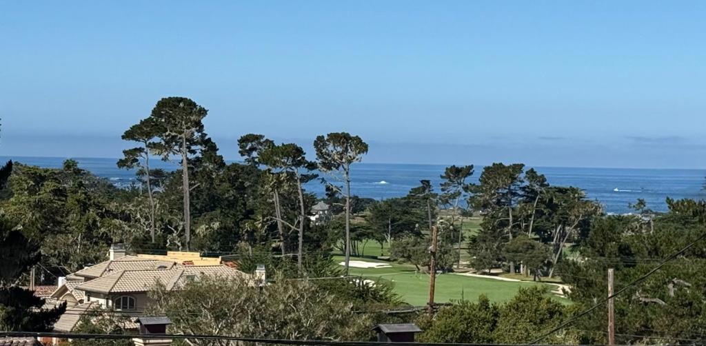 Opportunity awaits at this 4-bedroom, 2.5-bathroom home nestled in the desirable Country Club West area of Pebble Beach. Situated on an upward sloping generous 14,000 sq.ft. lot, this 1,930 sq.ft. residence offers the perfect blend of coastal location, gracious space short distance to the Monterey Peninsula Country Club. Enjoy MPCC Shore Course views, whitewater ocean and sunset views on the ocean from multiple vantage points. Easy access to Bird Rock Beach right down the street Monterey Peninsula Country Club almost right next door. Recently refreshed with new interior paint, flooring, windows and updated landscaping make this clean and well-maintained home move-in ready. Whether you're seeking a primary residence, a weekend retreat, or a smart rental investment, this property offers exceptional flexibility. Start looking towards the future to take full advantage of oversized lot and expansive views by starting your plans now for an additional or new home. Don't miss the rare opportunity to own a slice of Pebble Beach paradise on this large lot with ocean and golf course views in this premier location.