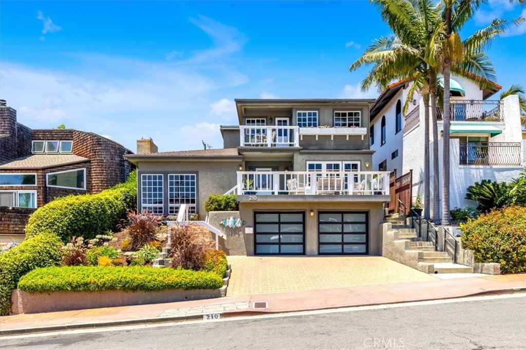 Just a few blocks from the shimmering Pacific Ocean in the highly sought-after Southwest area, on a wider-than-average street between T Street and Lost Winds, this charming and distinctive residence—masterfully crafted by a local builder—offers the ultimate coastal lifestyle. From the moment you arrive, the striking curb appeal sets the tone for what lies within. The expansive, multi-level floor plan is thoughtfully designed to provide both flexibility and comfort. The main level showcases an inviting open-concept layout featuring a bright kitchen with stainless steel appliances, double ovens, a wine refrigerator, and granite counters. The adjoining dining area, accented by a blend of wood and Spanish tile floors and beautiful beamed ceilings, flows seamlessly onto a charming deck with ocean views—perfect for morning coffee or sunset dinners. A sunken living room with floor-to-ceiling picture windows and a stunning stone wood-burning fireplace creates a cozy yet elegant gathering space, while the spacious family room is bathed in natural light from impressive skylights overhead. Upstairs, the primary suite is a true retreat, offering complete privacy along with its own private deck, a relaxing sitting area, a generous walk-in closet, and an en-suite bath featuring a jetted tub, separate shower, and dual vanities. A secondary upstairs bedroom with its own ocean-view deck and en-suite bath could easily serve as an additional primary suite—ideal for guests or multi-generational living.
On the lower level, you’ll find two additional bedrooms that open directly to the private backyard oasis and share a well-appointed bathroom. A large office or studio provides the perfect space for working from home or pursuing creative passions. The backyard is a serene haven for gardening enthusiasts and entertainers alike, boasting mature fruit trees, a dedicated herb and vegetable garden, a cozy fire pit for gathering under the stars, and even a workshop shed for hobbies and projects. Enjoy the coastal lifestyle to the fullest—walk the trail just minutes away to watch the sunset, ride your golf cart throughout the neighborhood for fun seasonal activities, or surf the renowned Trestles surfing spot nearby. Don’t miss this rare opportunity to own a truly unique coastal residence just steps from the Pacific Ocean, where timeless design, flexible living spaces, and outdoor serenity come together in one unforgettable home.