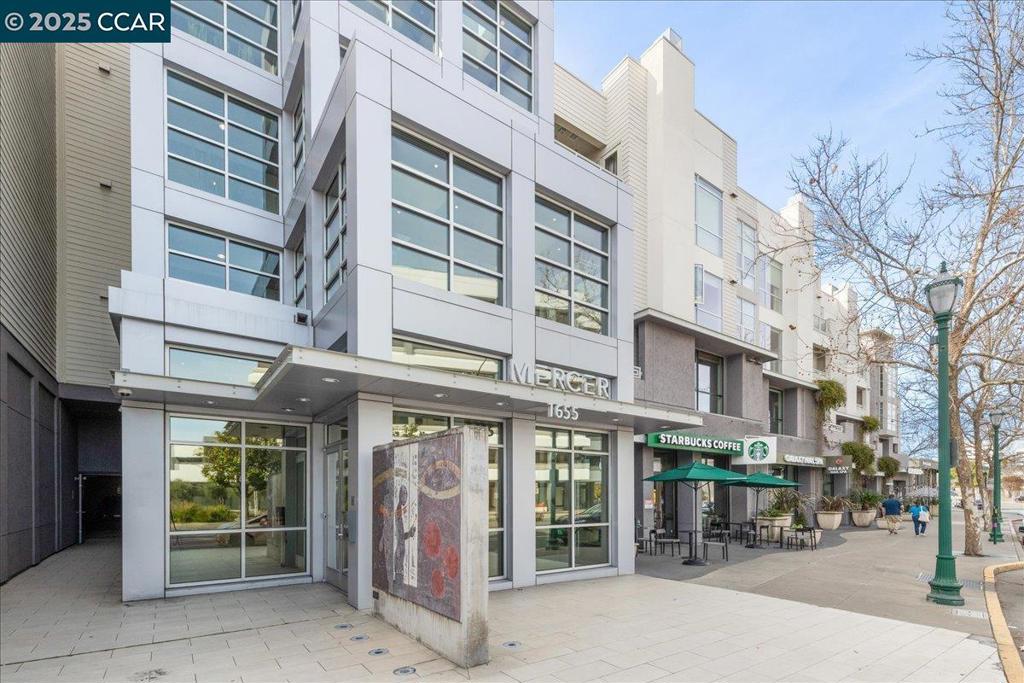 Are you Looking to live in downtown Walnut Creek? This exquisite second-floor unit at The Mercer offers the perfect blend of tranquility and sophistication. With a west-facing orientation, the unit is flooded with natural light, creating a bright and airy atmosphere throughout. This unit has beautiful views of the Berkley Hills and is surounded by bamboo but more importantly is very quiet. European oak floors, sleek Quartz countertops and backsplash, and high-end appliances, made by Bosch, and a Subzero refrigerator. The kitchen also features an upgraded utility sink. The living room with a custom porcelain surround gas fireplace, complemented by a stunning Restoration Hardware chandelier, creating a welcoming ambiance for relaxation or socializing. Hidden within the wall is a convenient Murphy bed. The Mercer offers unparalleled amenities, including a BBQ area, a fitness center, a gated entry, a spacious pool and spa, and a clubhouse. This unit also includes two private, gated, side by side parking spots and a dedicated storage area for your convenience. Ideally located, this home is just a short walk to the Walnut Creek BART station, providing seamless access to the greater Bay Area. Enjoy world-class dining and shopping at Broadway Plaza and Locust just steps from your door.