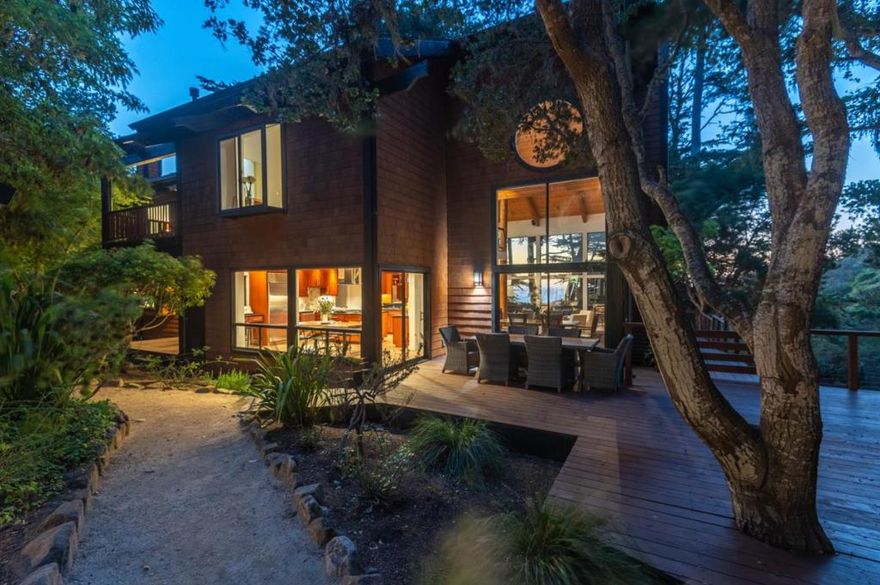 Carmel Highland Perfection..This gated estate are what dreams look like...behind the private gates, sits this amazing 5-bedroom 5- bath home and large detached studio/bath. Surrounded by a once in a lifetime environment of your private waterfall, wildcat creek, redwoods & even wildcat beach!  All create a magical Zen environment.  Your home is a wood & vaulted glass masterpiece that centers around a majestic granite fireplace vaulted glass walls with whitewater Ocean views. Includes 4 car garage with 220, full back up generator, recently updated with wide plank oak floors & new fixtures.  Just 5 minutes from downtown Carmel  A MUST SEE & FEEL to appreciate property.