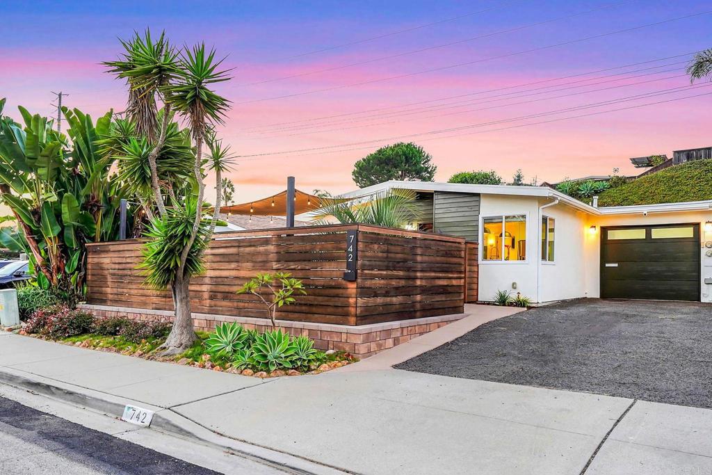 Welcome to a wonderful mid-century modern style twin home with two bedrooms and one bathroom in the highly sought after community of Pacific Serena in Encinitas. This open concept kitchen features quartz countertops, stainless steel appliances, a range hood, glass inset cabinetry, soft close drawers and a beautiful large island. Additional upgrades include air conditioning unit, luxury vinyl plank flooring, recessed can lighting throughout, ceiling fans, dual paned windows, closet organizers and sliding glass doors for indoor/outdoor living. Upon entering the private backyard with a large grassy lawn, guests will enjoy relaxing under the steel and wood pergola, gardening in the planter boxes and a convenient outdoor shower. The designer front yard with gorgeous plants and space to entertain with privacy and evening lighting. The private fenced and gated patio provides outdoor living and entertaining space, professionally landscaped, Ring security cameras at garage, front door and backyard, Rachio and Hubspace app-based irrigation and lighting systems. Fully irrigated fruit trees - nectarine, strawberry fig, apricot. Nectaplum, blood orange, Meyer lemon, kaffir lime, and pomegranate. Three Veggie raised beds with drip system. Don't miss the finished-out garage and designer stenciled flooring which could easily be used as an office, craft room, playroom, or exercise room. 220 volts hook up ready for a future Hot Tub. Enjoy ocean breezes and sunsets just 1.5 miles to the beach, walking distance to Encinitas Ranch Trails and located within top rated schools in the San Dieguito and Encinitas Union School Districts. NO HOA fees or Mello Roos. Located near the famous Moonlight Beach and San Diego Botanical Garden & close proximity to unique shops, top rated restaurants and gorgeous beaches make this the perfect place to call home!