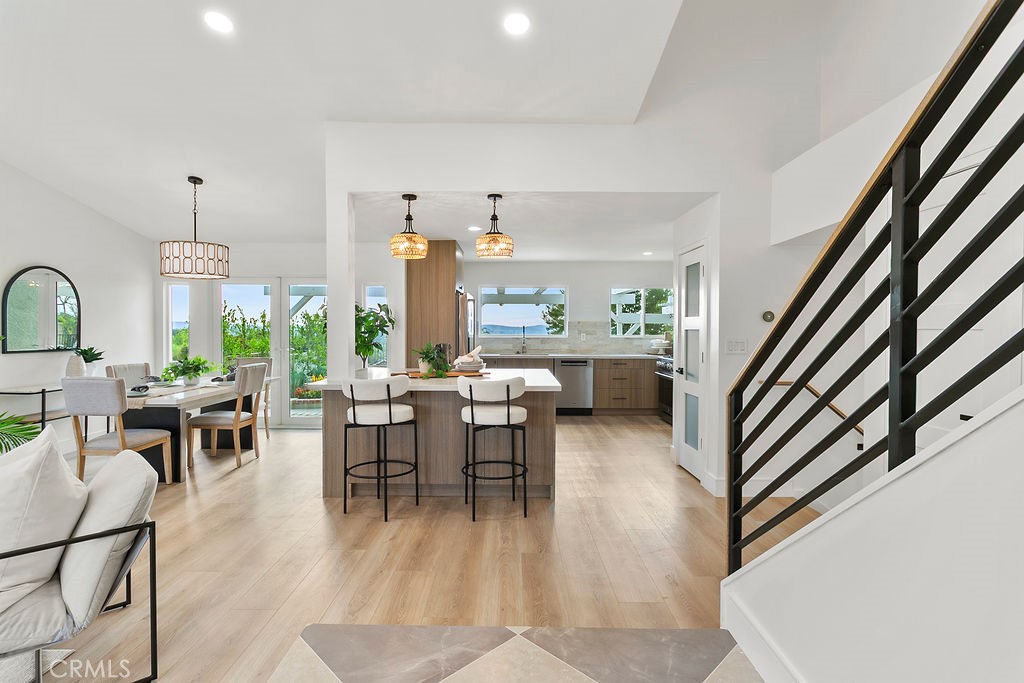 Welcome to 26175 Buscador — a fully renovated 4-bedroom, 4-bathroom showpiece nestled in one of Mission Viejo’s most desirable communities. Boasting a custom floor plan and BRAND NEW high-end finishes throughout, this home is the perfect blend of style, comfort, and quality.
Step inside to an expansive, light-filled layout featuring a formal living room, formal dining room, and a separate family room. The heart of the home is the open-concept kitchen, redesigned to include a large entertainer’s island, quartz countertops, custom soft close, white oak cabinetry, walk-in pantry and premium THOR stainless steel appliances—all overlooking the main living areas and sunset panoramic views.
Enjoy panoramic sunset views sitting around the fire pit from mountains to the ocean horizon. The backyard oasis is ideal for al fresco dining, relaxing, or hosting guests in style.
The private primary suite features a luxurious en suite bathroom. Additionally a permitted separate mother-in-law or guest suite offers its own en suite bath—ideal for multigenerational living or long-term guests.
All renovations were fully permitted by the City of Mission Viejo and completed by a licensed general contractor. Additional upgrades include wide-plank luxury flooring, dual-pane Milgard windows, upgraded HVAC, PEX plumbing, and electrical systems, and modern designer finishes in all bathrooms.
Located near top-rated schools, parks, shopping, dining, and Lake Mission Viejo. No Mello-Roos and low HOA dues. MUST SEE!