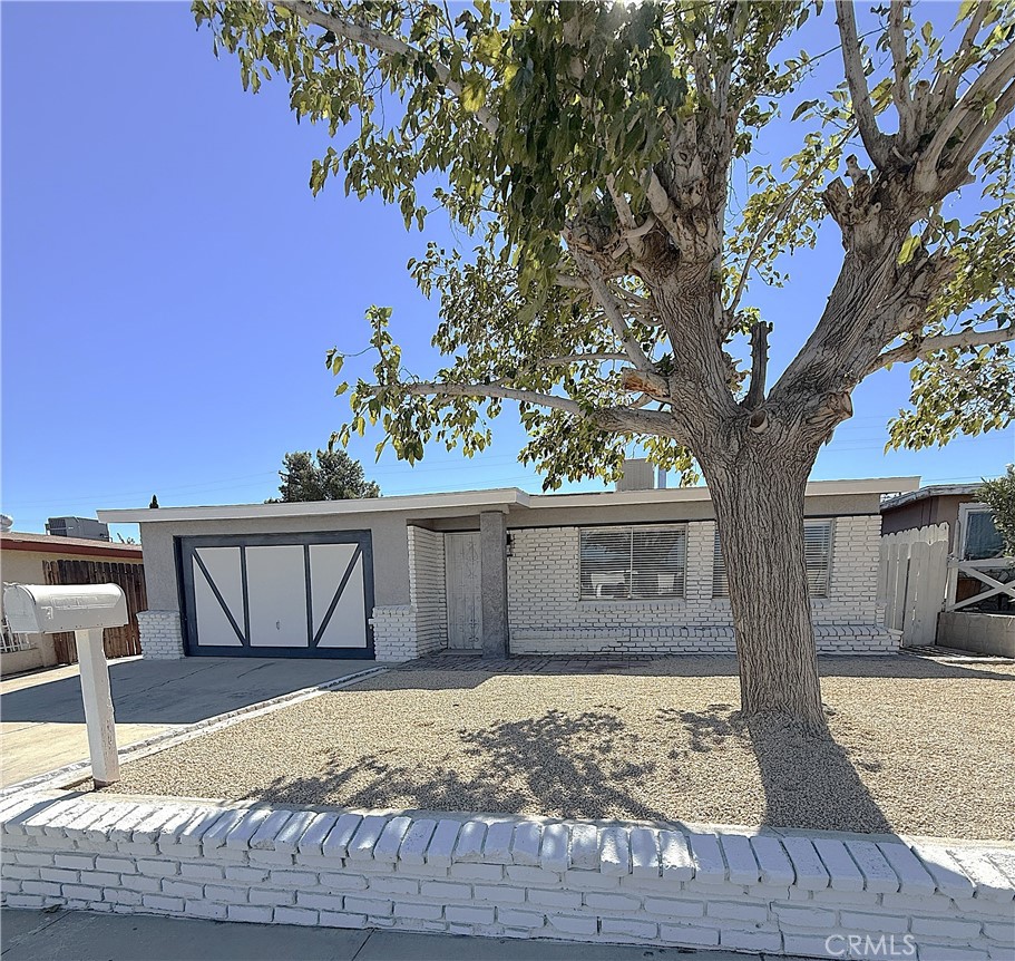 BRAND NEW MODERN UPGRADES!!! This 3 bedroom, 1 bath home is stunning! The installation of laminate flooring provides a consistent, wood-like finish throughout the main living areas, hallways, and kitchen and there is brand new carpet in all 3 bedrooms. The freshly painted interior makes this home spacious and airy and provides a blank canvas so you can add your own personal style. The kitchen has been completely updated with new cabinets, new appliances, granite countertops and a custom tile backsplash that adds a clean, contemporary look. The bathroom features a tile bath/shower, new vanity, new toilet and mosaic tile floor. The addition of streamlined ceiling fans and recessed lighting throughout the home adds comfort and style. The newly finished garage is in pristine condition with smooth, clean walls which are perfect for a workshop or securely parking your vehicles. The exterior of the house has been freshly painted and the backyard is fully fenced. New windows have been added for energy efficiency and security. Located close to schools, shopping and parks. This house is even more beautiful in person!