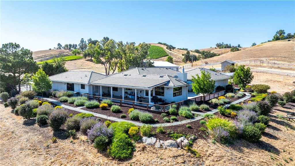 Welcome to 2885 Summer Ranch Road, an exceptional retreat nestled in the heart of Paso Robles Wine Country, where rolling hills and breathtaking vineyards create the perfect backdrop for everyday living.
This sprawling ranch-style estate sits on 10 fully usable acres and offers the best of wine country living. With 4 spacious bedrooms, 4 full, luxurious bathrooms, and an expansive open floorplan, this home blends comfort and sophistication with ease. The gourmet kitchen is a chef’s dream—featuring upgraded appliances, ample counter space, and a circulating hot water system for added efficiency.
The primary suite is a sanctuary unto itself—designed to evoke the serenity of a luxury resort. Relax in the soaking tub or rejuvenate in the large walk-in shower. Dual his/her powder rooms, for the ultimate privacy!! Two oversized walk-in closets with built-ins offering an abundant amount of storage and elegance.
Thoughtful amenities abound, including an owned solar system, well and water tank, a Tesla charger in the garage and deer fencing around the property. For the hobbyist or entrepreneur, the property also boasts a 2,400+ sq ft insulated metal shop/barn with Two 12 X 12 roll up doors. Perfect for projects and storage, as well as a stand alone tack room.
The land is a blank canvas with endless possibilities—bring your animals, add an ADU, or plant your very own vineyard and live the wine country dream.
Peaceful, private, and incredibly scenic, this property is a rare opportunity to own a slice of Paso Robles paradise.
Don't miss your chance to experience the magic of 2885 Summer Ranch Road—schedule your private showing today!