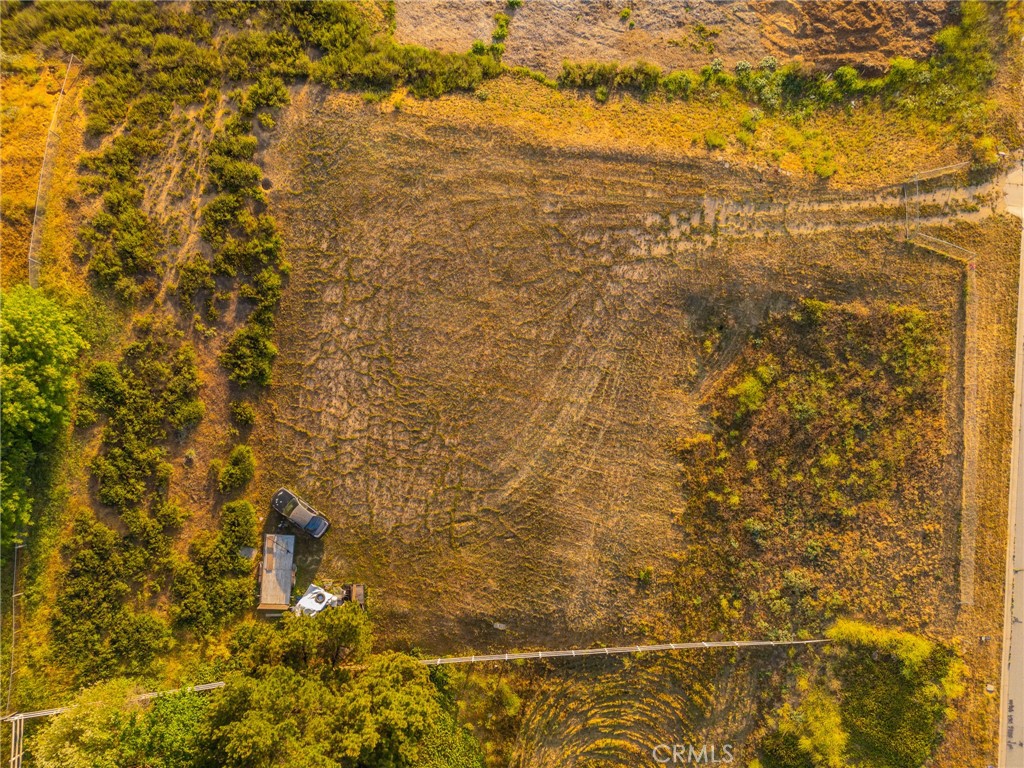 Welcome To Your Future Dream Home Site!  
Lot sits on over a half-acre in beautiful Yucaipa CA with water meter onsite and many of the city fees paid.  Lot comes with plans for a 2102 Sq Ft Home!