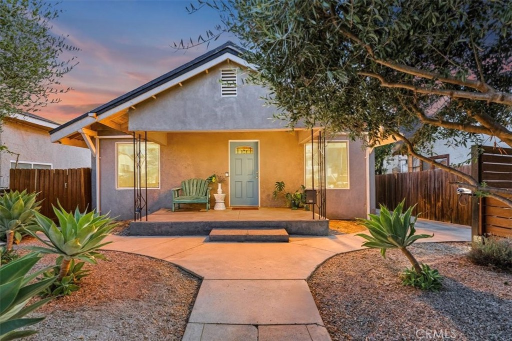 Fall in Love with Boyle Heights Living. This beautifully updated 3-bedroom, 2-bath home captures everything that makes Los Angeles special, warm neighbors, vibrant murals, hillside views, and the perfect balance of city convenience and neighborhood charm. The open-concept layout showcases a modern cook’s kitchen with quartz countertops, glass-front cabinetry, stainless steel appliances, and seamless flow into the living and dining areas. Both bathrooms have been stylishly upgraded with contemporary vanities and fixtures. Newer improvements include updated flooring and windows throughout, recessed lighting, crown molding, central A/C, copper plumbing, a roof in excellent condition, solar panels, an electric car charger, and an automatic gate. A versatile bonus room provides flexible space for a walk-in closet, pantry, or extra storage. Outside, the private backyard is perfect for entertaining or simply relaxing. Located just minutes from DTLA and the Arts District (even closer via the new 6th Street Bridge!) as well as Northeast LA, you’ll also enjoy easy access to some of Boyle Heights’ most beloved spots: Brooklyn Pizza, Los 5 Puntos, Barrio, Picaresca Café, Ray & Roy’s Market, the OG Guisados, and the famous Mariachi Plaza. Best of all, this home qualifies for the USC Neighborhood Homeownership Program—a rare and valuable opportunity for eligible USC employees.
