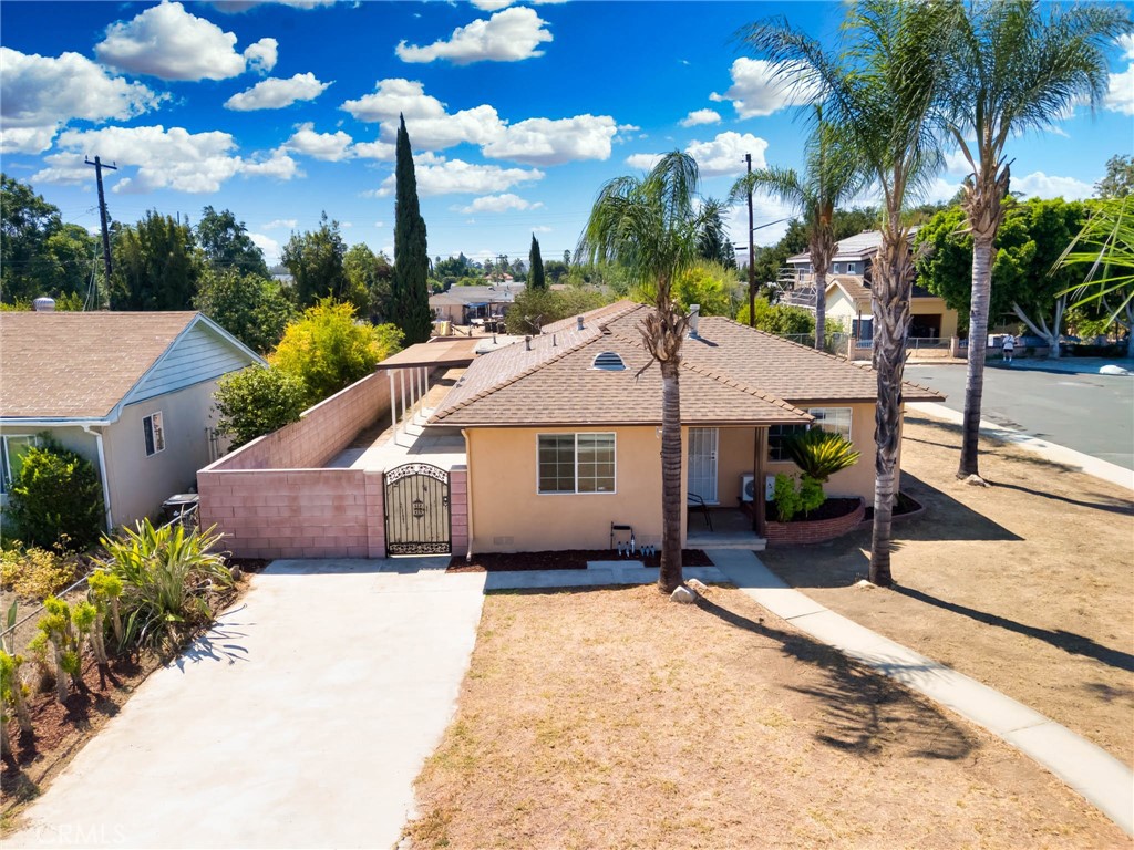 Nestled on a spacious corner cul-de-sac lot of nearly 8,100 sq. ft., this exceptional Pomona home offers 1,583 sq. ft. of living space with 3 bedrooms and 3 bathrooms. Designed with a unique duplex-style layout, the front unit features 2 bedrooms, 2 full baths, generous kitchen, dining area, and living room. The rear unit includes 1 bedroom, 1 full bath, living room, and compact kitchen, with access to the attached 2-car garage. Recent updates include fresh interior paint, updated kitchen and bathrooms. The expansive sideyard and backyard provide excellent potential for an ADU or additions. Ideal for multi-generational living, live in one and rent the other, or as a full investment property. Centrally located near Western University of Health Sciences, with easy access to shopping including Costco, Target, and Walmart, major freeways (10, 57, 210, 60, 71), and just minutes from the vibrant Claremont Village. Rare Gem in Prime Pomona Location!
