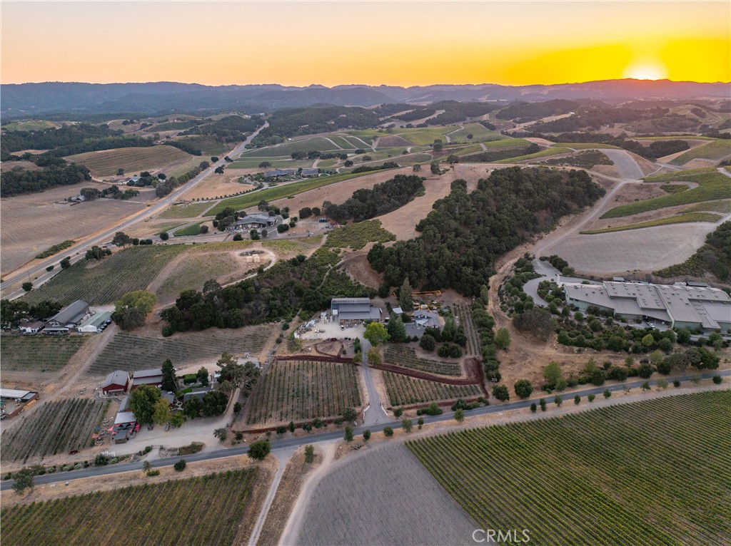 Rooted in Paso Robles, this exceptional opportunity offers a renowned winery and tasting room in the prestigious Willow Creek District, the heart of Hwy 46 West, surrounded by Paso's elite wine brands. This 10.5-acre property combines a rich history with high-caliber winemaking infrastructure, providing an ideal location for producing and selling up to 15,000 cases of wine annually. Located near Booker Winery and other Paso Robles icons, this winery offers both heritage and advanced production capabilities. The 10-acre parcel includes a 5,000 sq. ft. indoor production facility, a 5,000 sq. ft. covered outdoor area, and a 2-acre Malbec vineyard with additional plantable land. Fully permitted and ADA compliant, the property is designed for continued production and potential expansion. Its expansive outdoor hospitality venue provides a perfect setting for events, music, and tastings, making it a compelling location for wine enthusiasts. Brand, Business and wine inventory are negotiable.