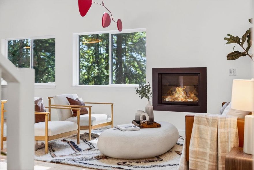 This stunning modern mountain home offers the perfect blend of privacy and convenience. Nestled in a serene end-of-the-road location, the home is just a short drive from town but feels far away. With plenty of sun streaming through large picture windows, every room in the house is filled with natural light and offers views of the surrounding landscape. Enjoy the outdoors with Fall Creek park trail right outside the door. The open and bright living room/kitchen is equipped with modern KitchenAid appliances and a Wolf induction stove top. The spacious primary suite is a peaceful retreat, complete with a walk-in closet and a luxurious soaking tub for ultimate relaxation, a bathroom on every floor. A large 4th bonus room offers possibilities, a media room, or a guest room, depending on your needs. An additional bonus room used as a sewing room and 2 car garage, lots of parking. With a brand-new roof installed in 2023 and a new leach field in 2022, this home provides both comfort and peace of mind. This is not your average mountain home.